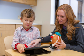 Boster working with child