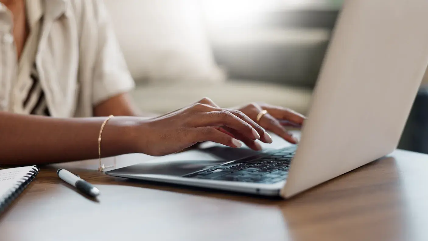 Person typing on laptop