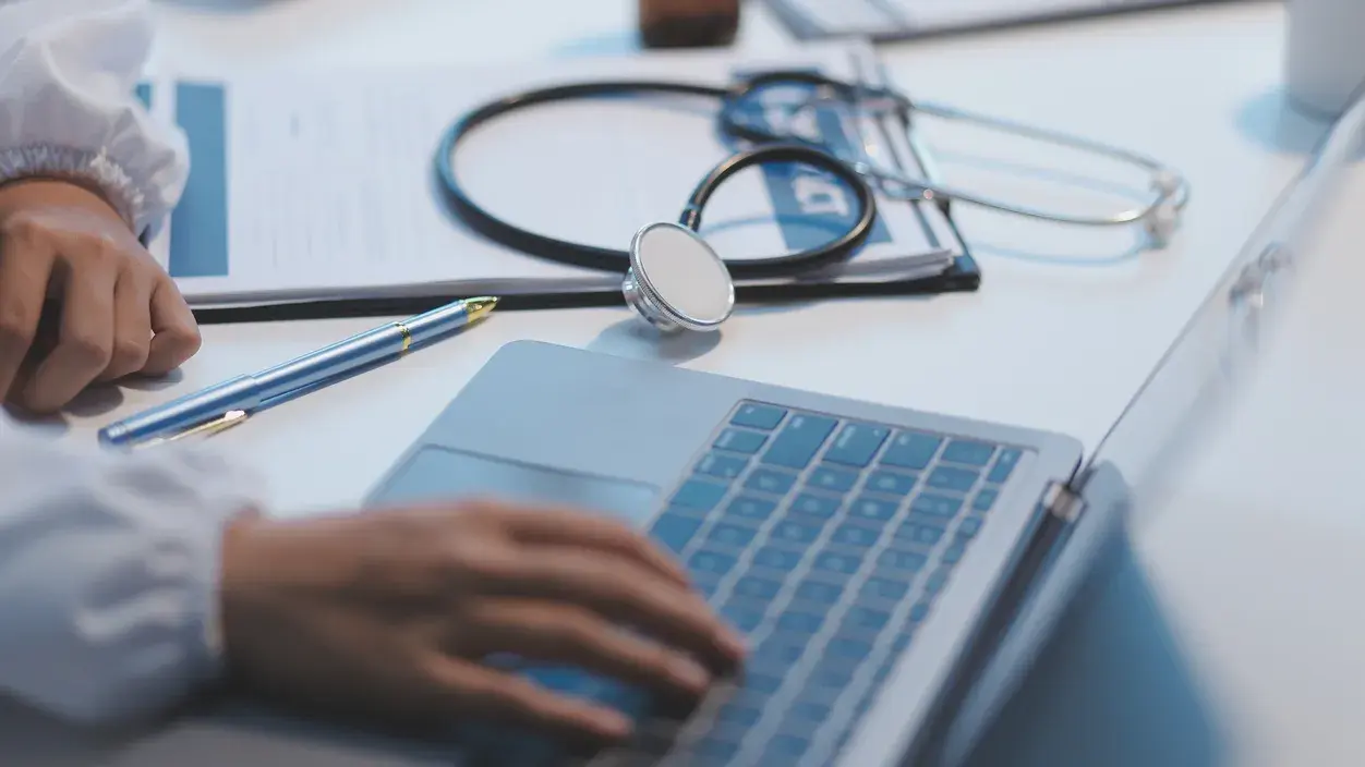 Doctor using laptop